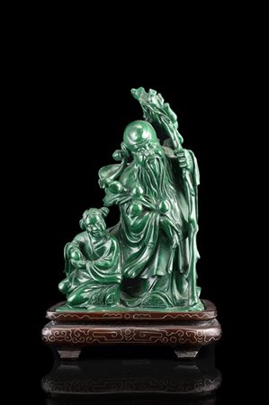 Gruppo in malachite raffigurante saggio con discepolo, base sagomata in legno
C