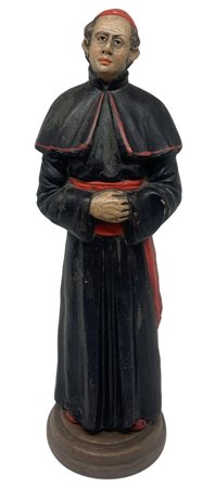 Statuetta in cotto raffigurante Monsignore con Papalina rossa, XX secolo. H...