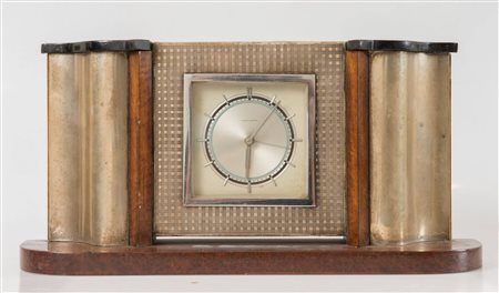 Orologio in stile Art Decò. Anni '30. Con cassa in radica, legno ebanizzato e...