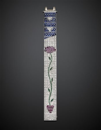 Bracciale in oro bianco a fascia con disegno floreale in smeraldi e rubini su p