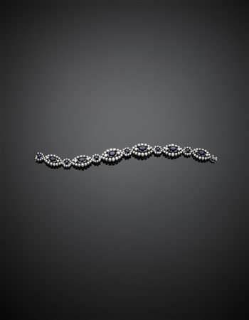 Bracciale modulare in platino a motivi a navette e rotondi con diamanti per com