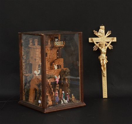 Lotto composto da un presepe contenuto in teca (cm 21x33x21) ed un Cristo croce