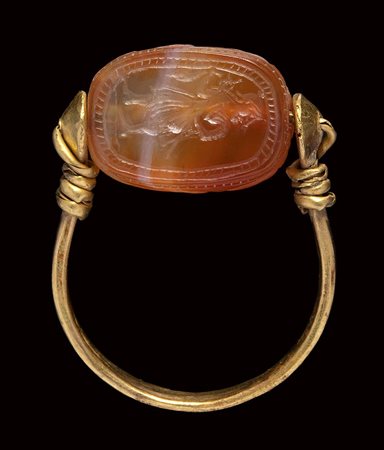 An etruscan agate scarab intaglio, mounted on an ancient gold ring. Hermes.
