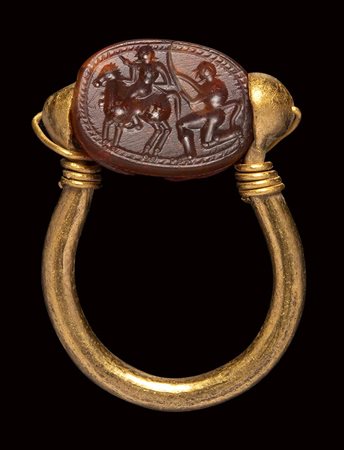 An etruscan carnelian scarab intaglio, mounted on an ancient gold ring. Warrior and Faun. 