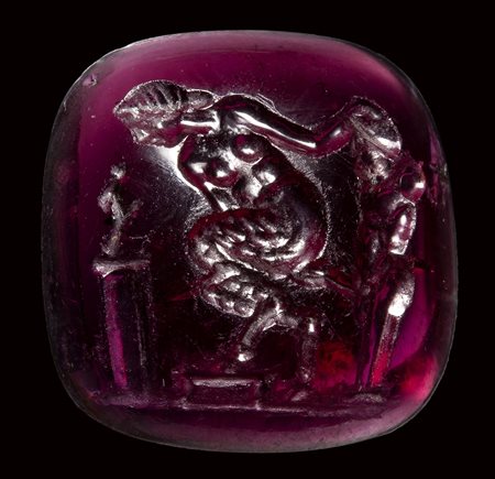 A fine late hellenistic garnet intaglio. Erotic scene with herm.