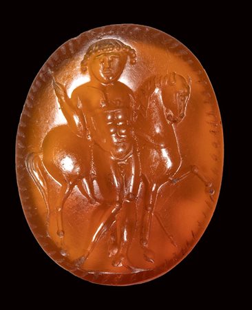 A roman italic carnelian intaglio. Male figure with a horse. 