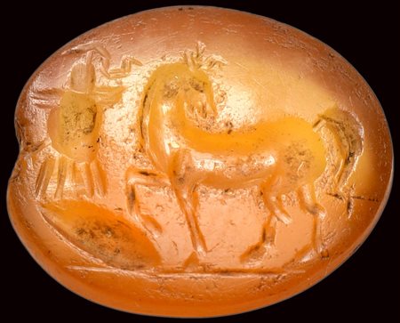 A  roman carnelian intaglio. Horse with military trophy. 