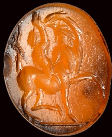 A roman carnelian intaglio. Centaur with a child. 