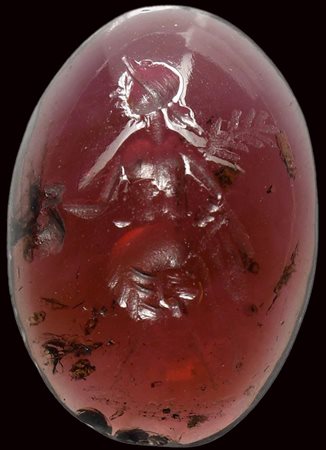 A rare roman garnet intaglio. Hybrid female creature. 