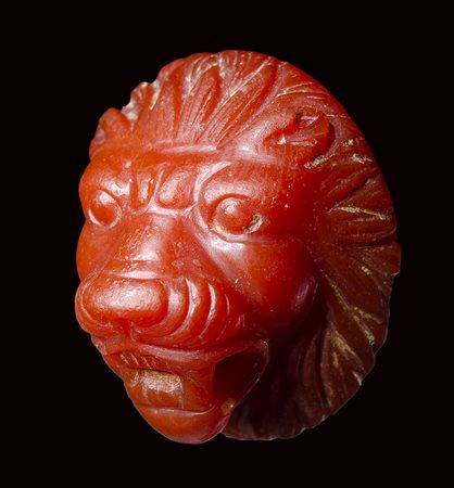 A fine roman carnelian applique-cameo.  Frontal  head of a lion.  