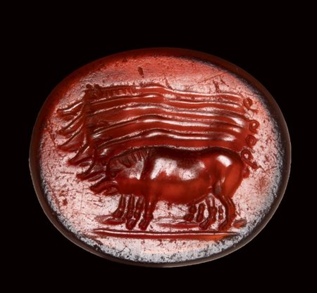 An unusual roman carnelian intaglio. Six boars.  