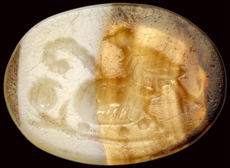 A roman italic banded agate intaglio. Bird with attributes. 