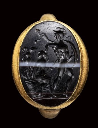 A roman banded agate intaglio set in a gold ring. Ajax with Cassandra. 