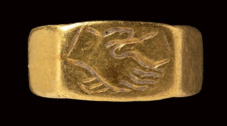 A roman gold engraved child ring. Dextrarum Junctio.