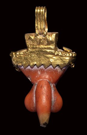 A gold and coral roman apotropaic phallic pendant.