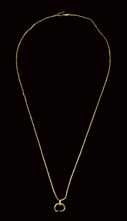 
A roman gold necklace with a moon crescent pendant (lunula).