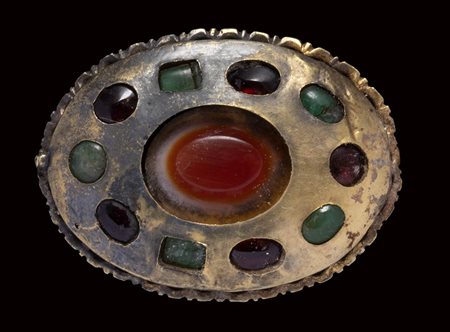 A late roman large gold brooch set with an agate, garnets and emeralds