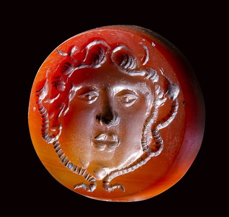 A large early medieval agate intaglio. Medusa mask.  