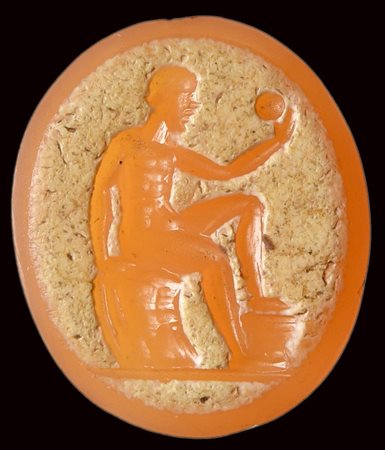 A postclassical agate intaglio. Seated  male figure with a globe. 