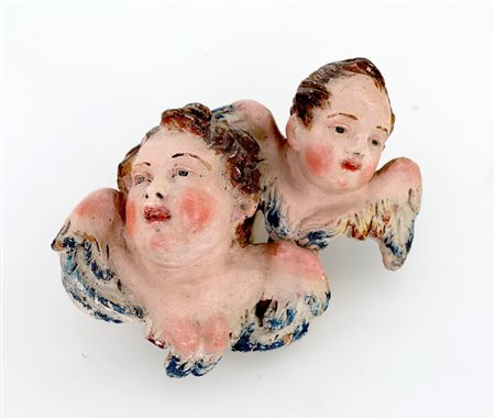 Coppia di cherubini legati - terracotta policroma, occhi di vetro - cm 8x12
