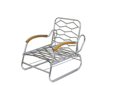 POLTRONA - Poltrona in tubo metallico cromato. Braccioli in legno....
