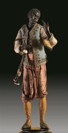 Moro suonatore con pantaloni a righe avorio e rosso, gilet in tessuto azzurro...