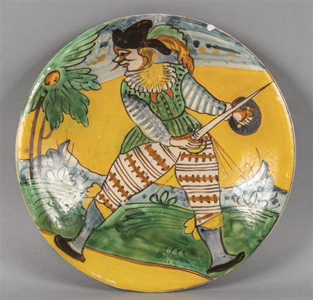 Piatto in maiolica policroma con al centro 