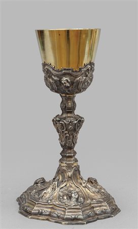 Calice in argento Luigi XV sbalzato con teste di 