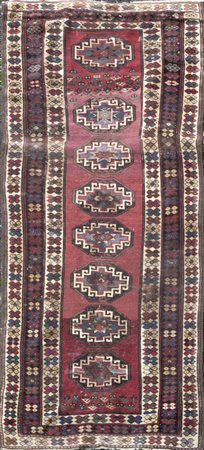 Tappeto caucasico con otto medaglioni su fondo 