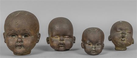 Quattro teste in bronzo, calchi per bambole, 