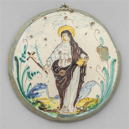 Placca in maiolica raffigurante Santa con 