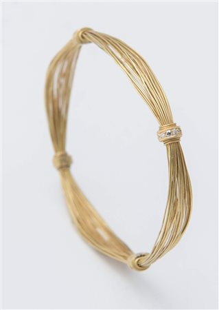 BRACCIALE IN ORO GIALLO E DIAMANTI en suite con gli orecchini lotto 40....