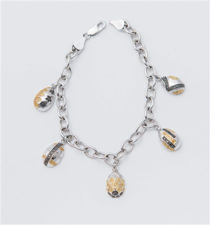 BRACCIALE IN ORO E DIAMANTI ad una fila di maglie ovali in oro bianco a cui...