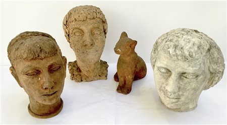 Lotto composto da tre sculture raffiguranti volti ed una raffigurante gatto di