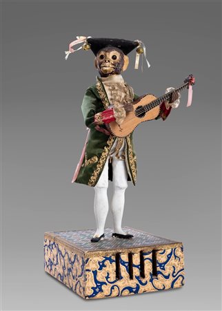 Antico automa con scimmietta che suona la chitarra