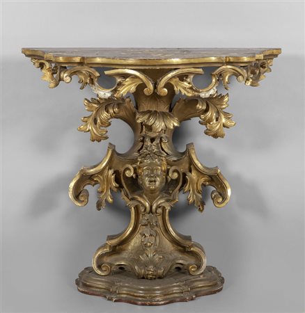 Console in legno intagliato e dorato a volute 