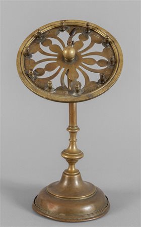 Curioso gioco in ottone, sec.XIX<br>h.cm.29,5