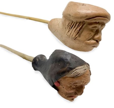 Coppia di pipe. â€œ Contadino dormienteâ€œ , Catania, Sicilia. Seconda metÃ  del â€˜1900.
Lunga pipa con fornello e cann