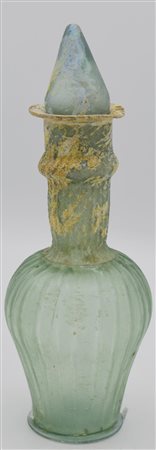 UNGUENTARIO A BOTTIGLIA DATAZIONE: III-V sec. d. C. MATERIA E TECNICA: vetro...