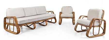 UN DIVANO E DUE POLTRONE, anni '60. <br>Malacca, 