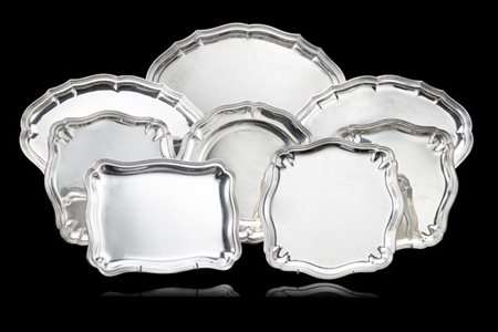 Lotto composto da otto piatti a servire di diversa forma in argento con bordi m