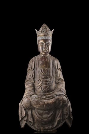 Scultura lignea raffigurante Guanyin coronata e assisa, tracce di doratura (dif