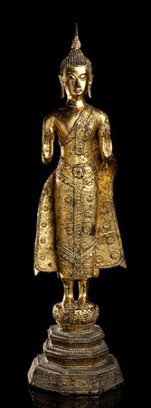 BUDDHA STANTE IN METALLO DORATO<br>Thailandia, XX secolo