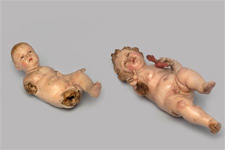 Lotto di due sculture da presepe in terracotta e legno raffiguranti Gesù Bambino, Napoli secolo XIX