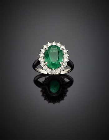 *Anello in oro bianco con smeraldo di ct. 3,80 circa e diamanti per complessivi