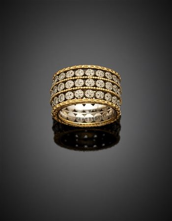 TAGLIABUE
Anello a fascia in oro giallo e bianco cesellato rifinito con diamant