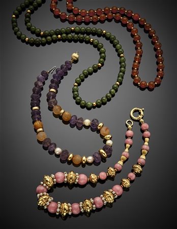 Lotto composto da quattro collane in pietre dure varie in parte scolpite e perl