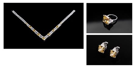  BURMA - Parure in argento e pietre dure sintetiche (burmalite) bianche e gialle, composta da collana,coppia di orecchini e anello.