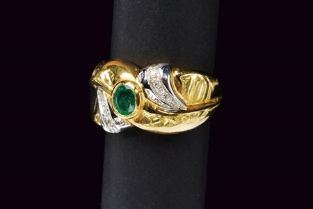 Anello in oro diamanti e smeraldo 