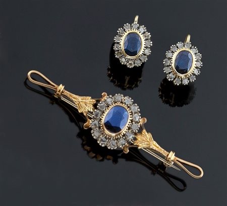 DEMI-PARURE Demi-parure in oro giallo e argento composta da spilla a forma di...